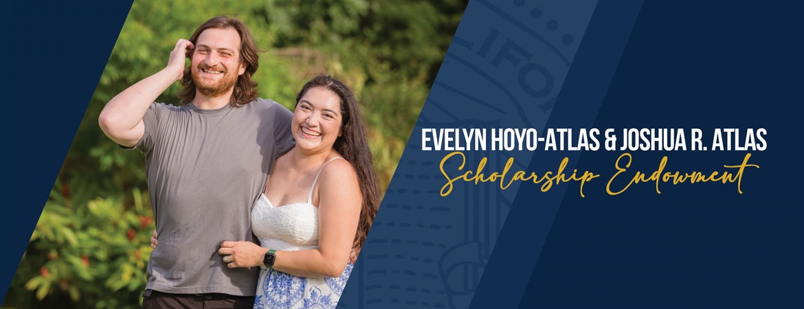 Alumni Joshua R. Atlas and Evelyn Hoyo-Atlas pictured against a green outdoor backdrop.
